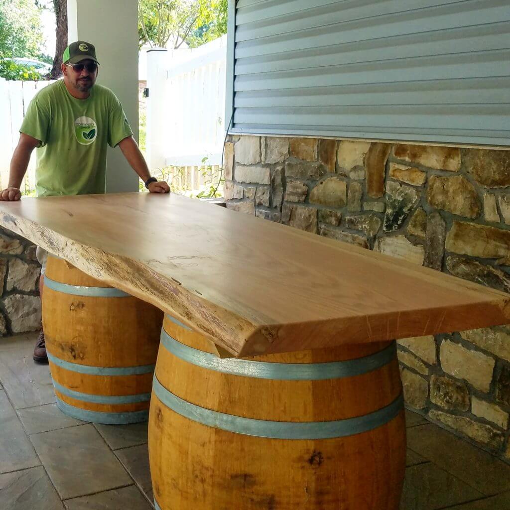 Giant oak live edge slab on reclaimed wine barrels