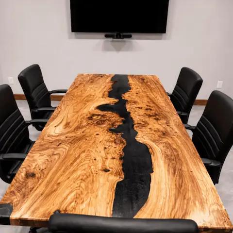 Black epoxy table with burl elm slabs